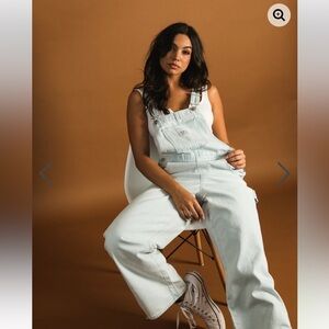 Levi’s light wash carpenter overalls with frayed hem